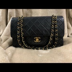 CHANEL metalasse black lambskin double flap bag.